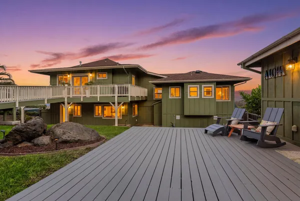 a kitchen with stainless steel appliances granite countertop a sink a refrigerator and a granite counter tops