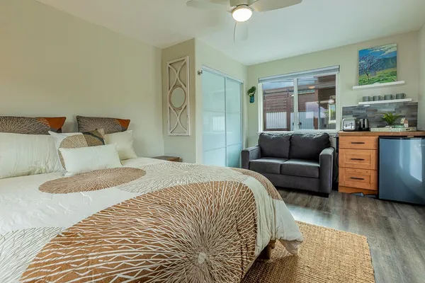 a bedroom with a bed and a couch