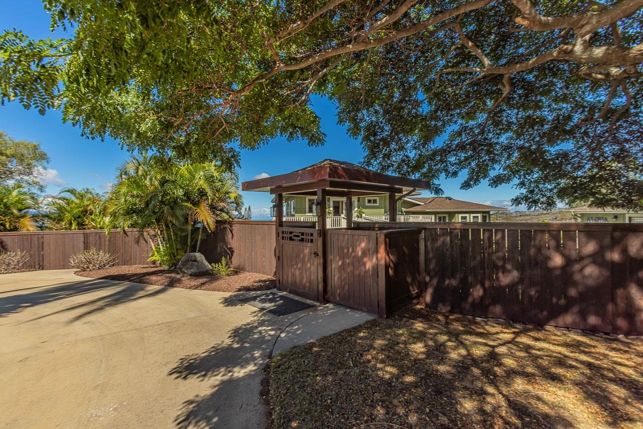 1350 Naalae Road Kula, HI 96790 - Photo 41 of 50 A charming covered gated entry beside a majestic monkeypod tree