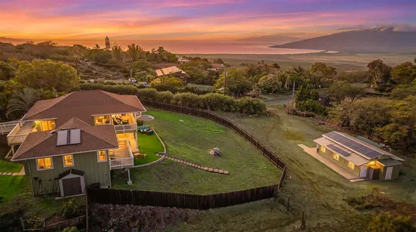 a view of a back yard from a balcony