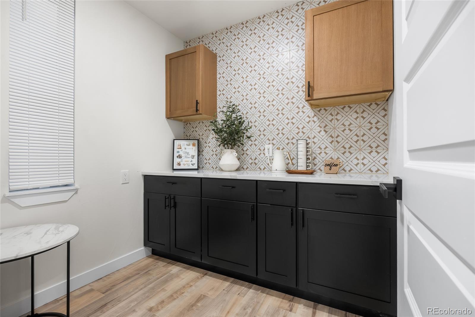 2011 West Scott Place Denver, CO 80211 - Photo 13 of 46 a bathroom with a sink and a mirror