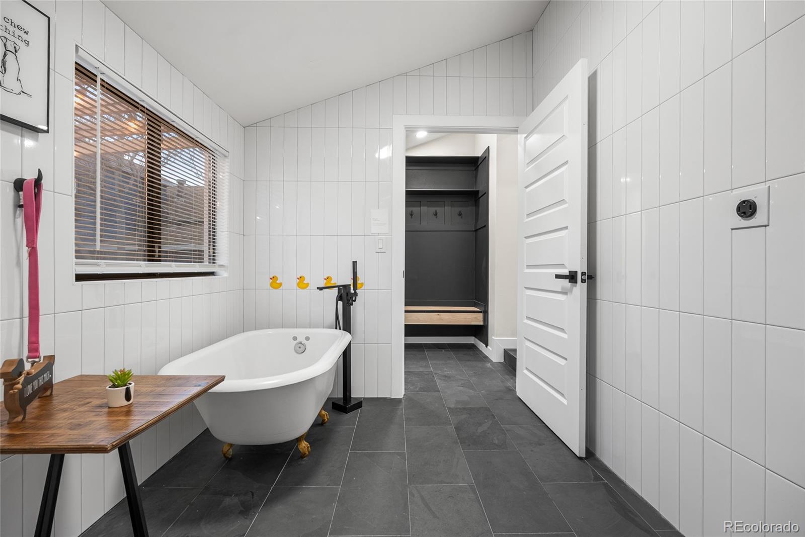 2011 West Scott Place Denver, CO 80211 - Photo 19 of 46 a spacious bathroom with a tub sink and shower