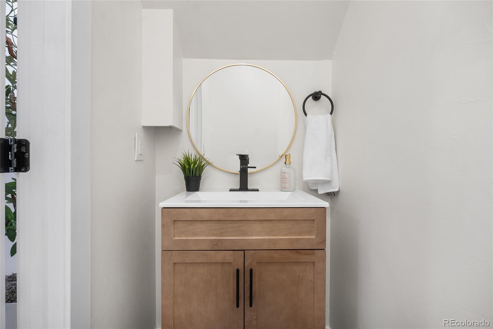 2011 West Scott Place Denver, CO 80211 - Photo 21 of 46 a close view of light fixtures and a mirror