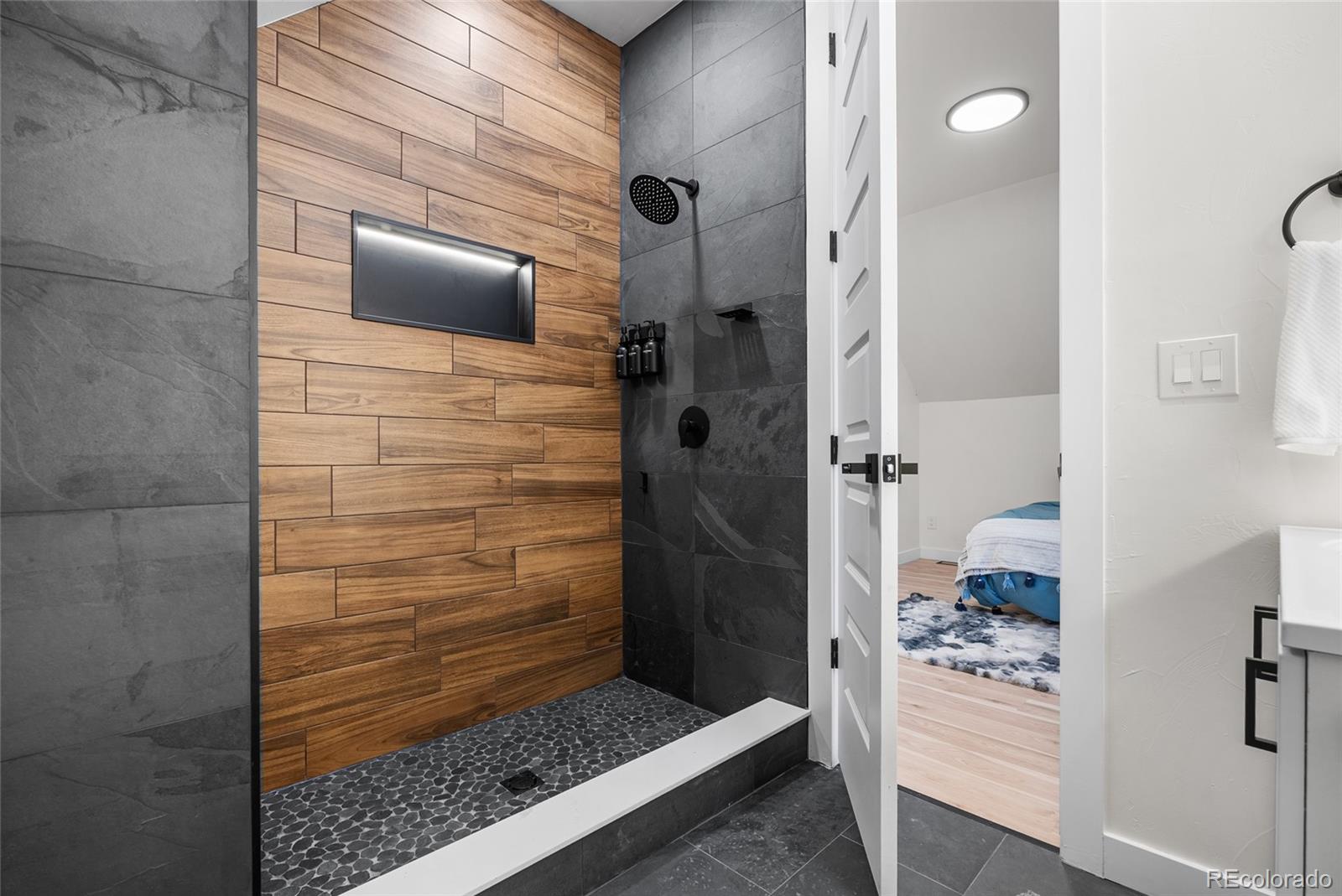 2011 West Scott Place Denver, CO 80211 - Photo 25 of 46 a bathroom with a shower