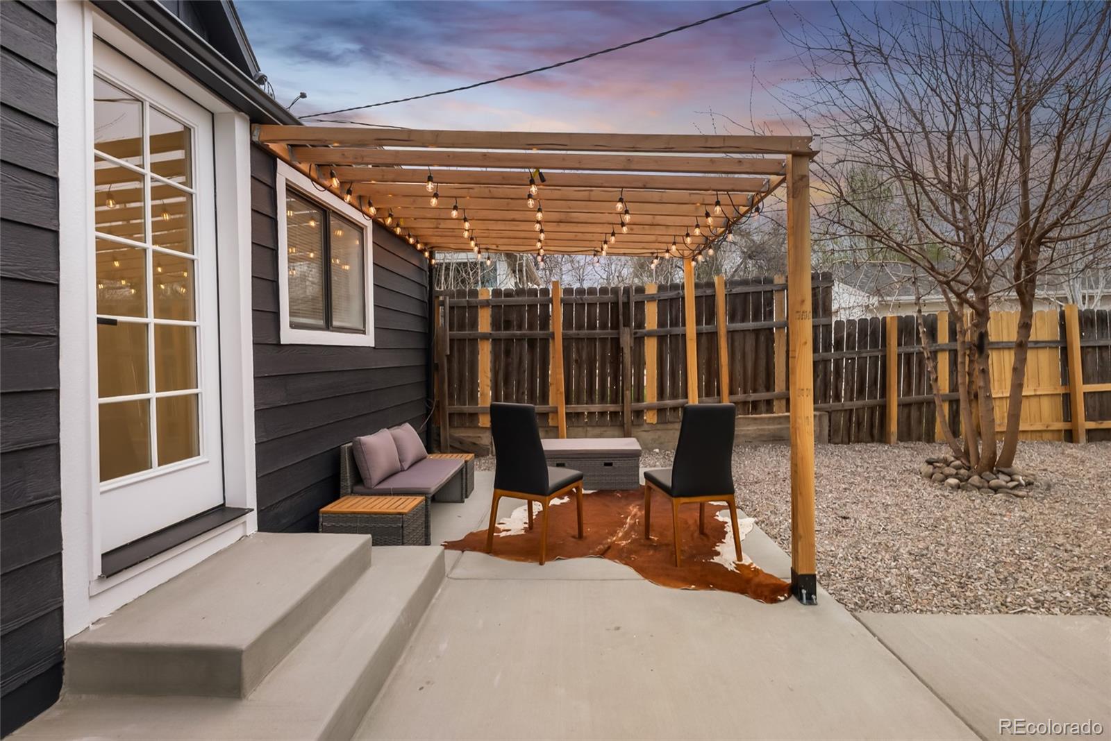 2011 West Scott Place Denver, CO 80211 - Photo 34 of 46 a building outdoor space with patio furniture and potted plants