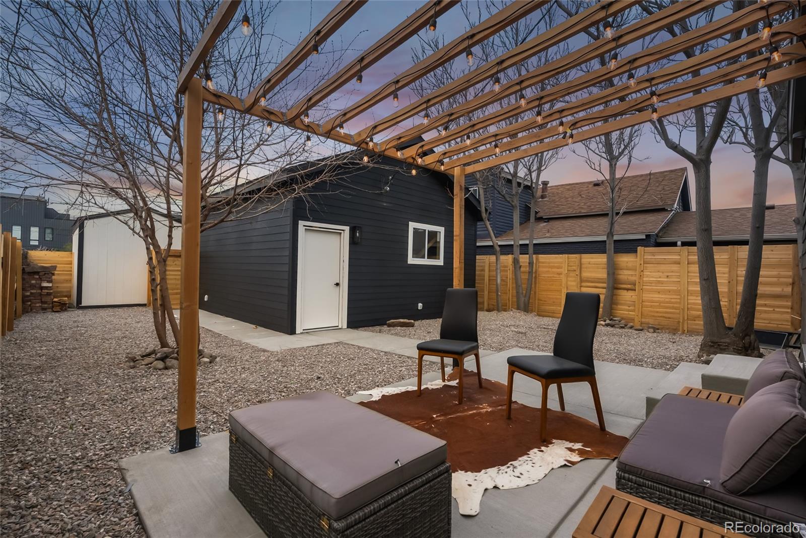 2011 West Scott Place Denver, CO 80211 - Photo 36 of 46 a backyard of a house with outdoor seating