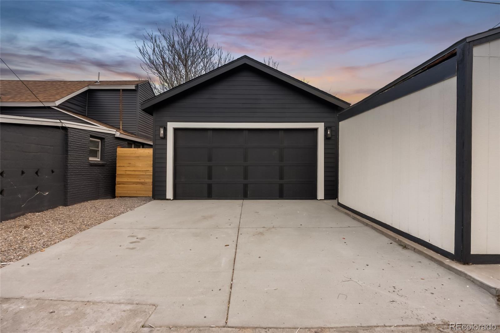 2011 West Scott Place Denver, CO 80211 - Photo 37 of 46 a front view of a house with a garage