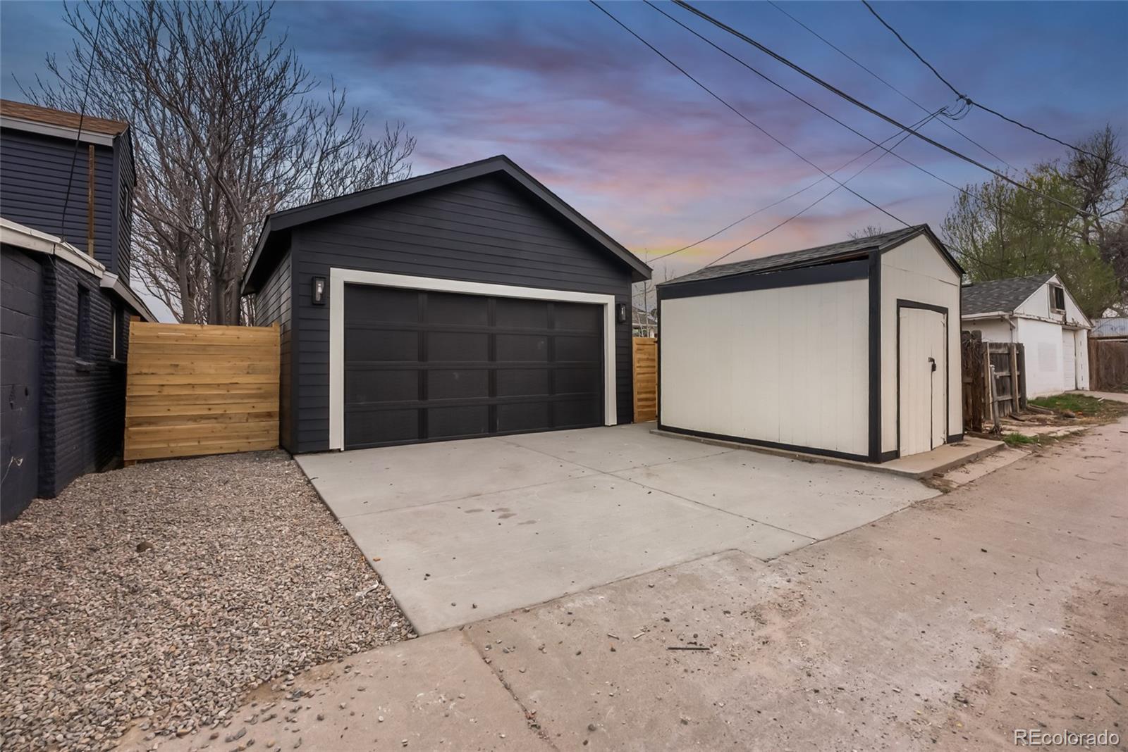 2011 West Scott Place Denver, CO 80211 - Photo 38 of 46 a front view of a house with a yard and garage
