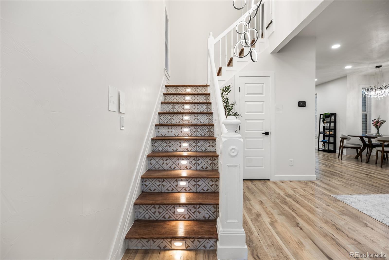 2011 West Scott Place Denver, CO 80211 - Photo 5 of 46 a view of entryway and hall with wooden floor