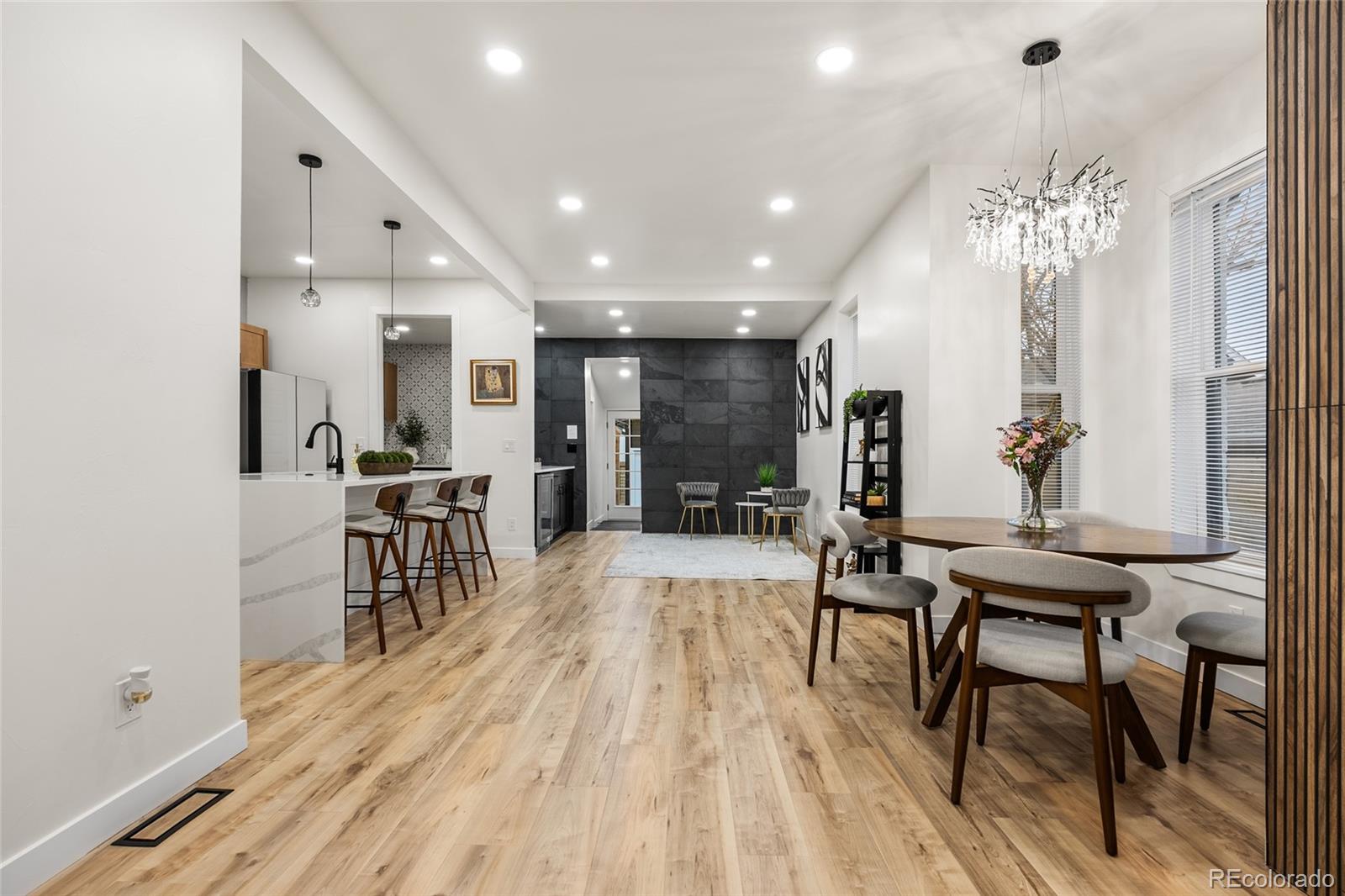 2011 West Scott Place Denver, CO 80211 - Photo 7 of 46 a view of a a dining room with furniture window and wooden floor