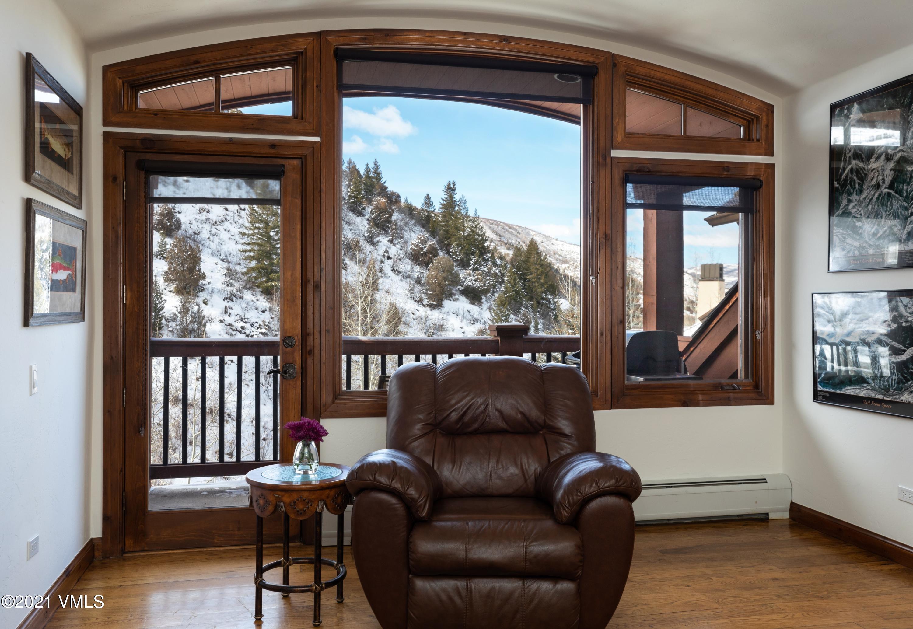 160 Cresta Road, Unit R402 Edwards, CO 81632 - Photo 3 of 8 a living room with furniture and a window