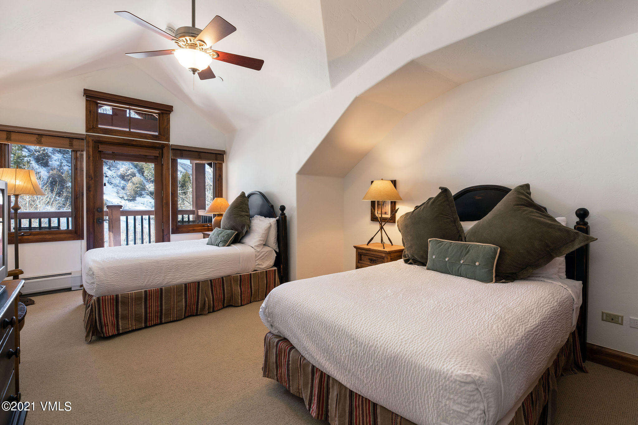 160 Cresta Road, Unit R402 Edwards, CO 81632 - Photo 6 of 8 a bedroom with two beds and ceiling fan