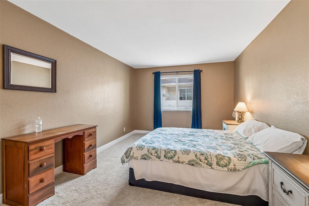 229 Red Maple Place Brandon, FL 33510 - Photo 13 of 45 a bedroom with a bed and a dresser