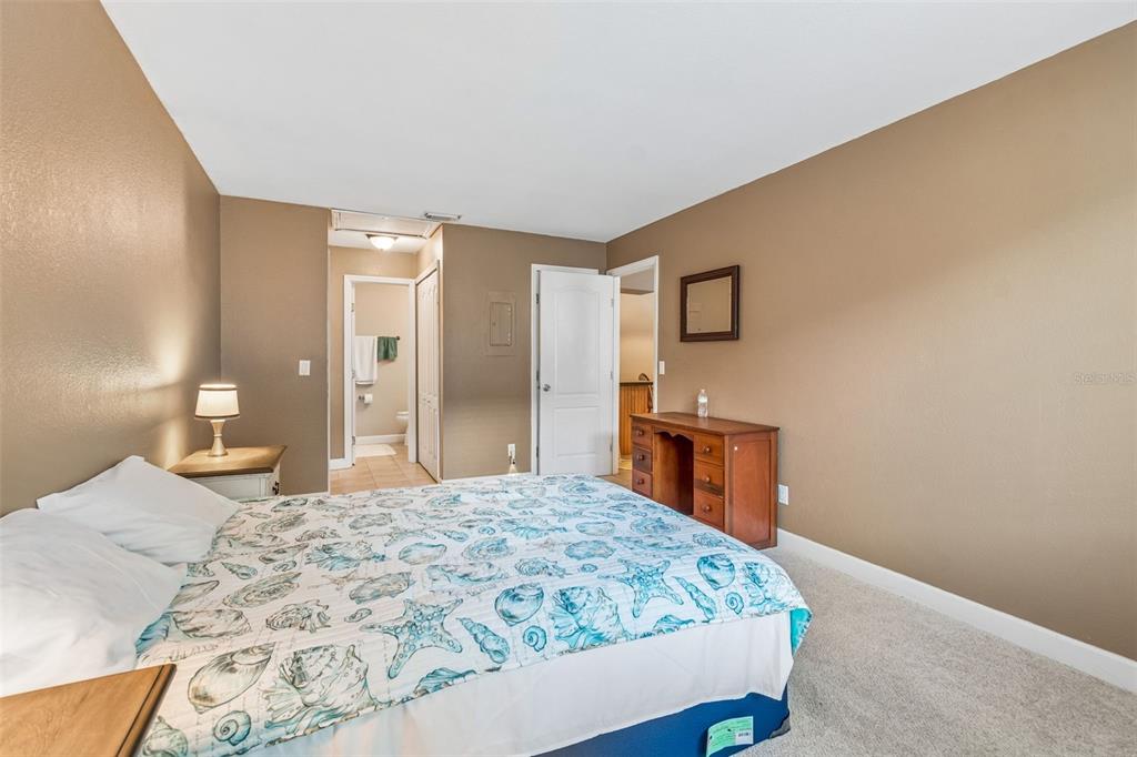 229 Red Maple Place Brandon, FL 33510 - Photo 14 of 45 a bedroom with a bed and a dresser in it