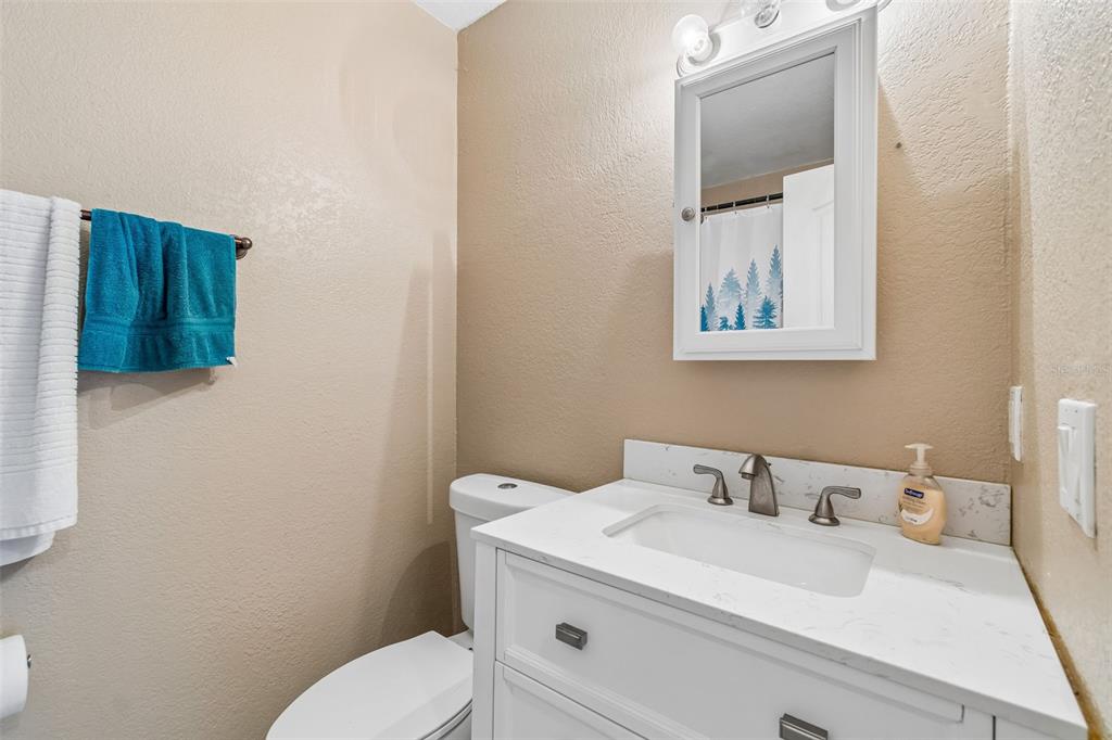 229 Red Maple Place Brandon, FL 33510 - Photo 16 of 45 a bathroom with a toilet sink and mirror