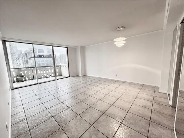 a view of an empty room and window