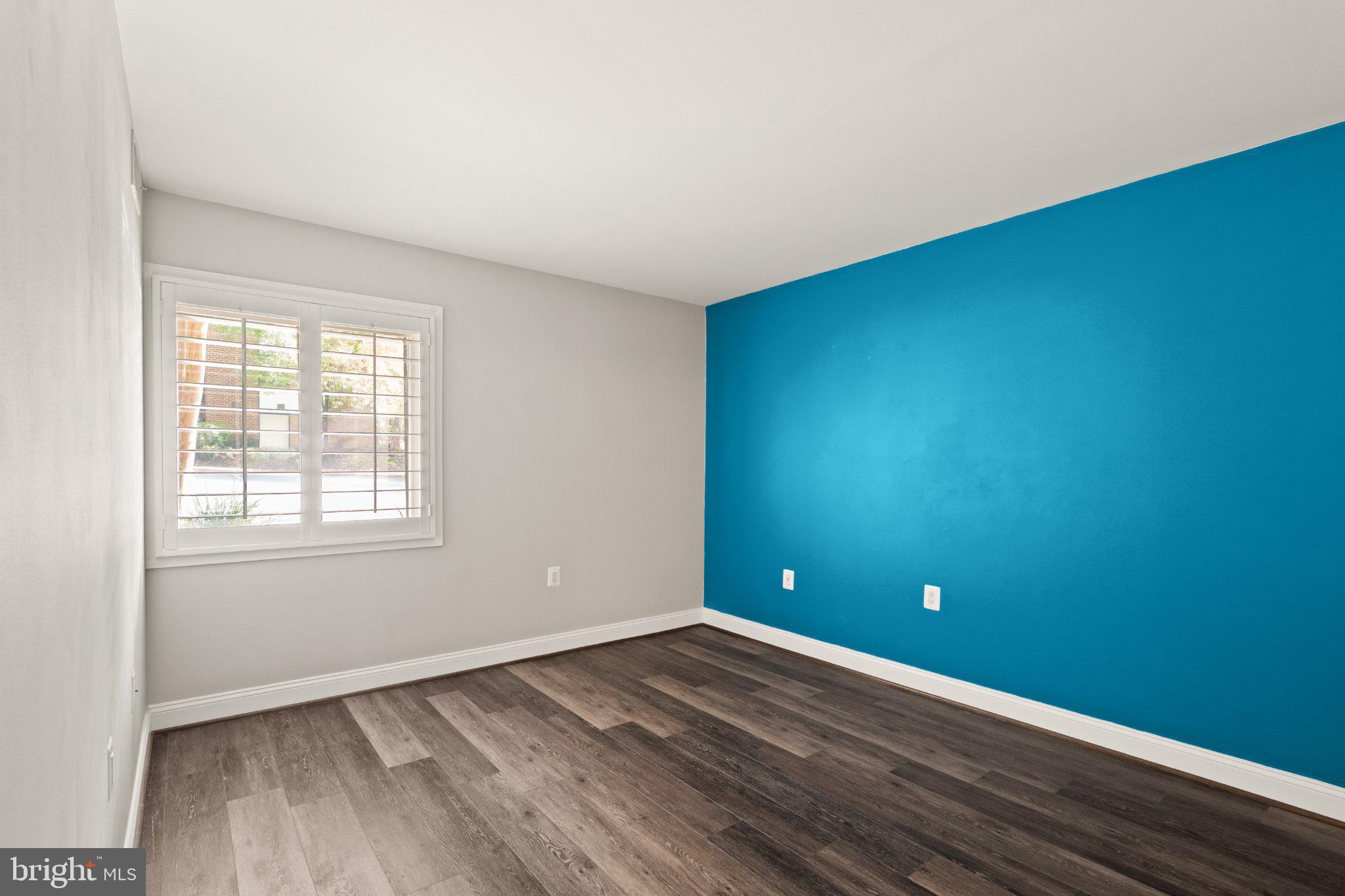 1414 Northgate Square, Unit 14/1B Reston, VA 20190 - Photo 22 of 49 Primary bedroom hosts accent wall