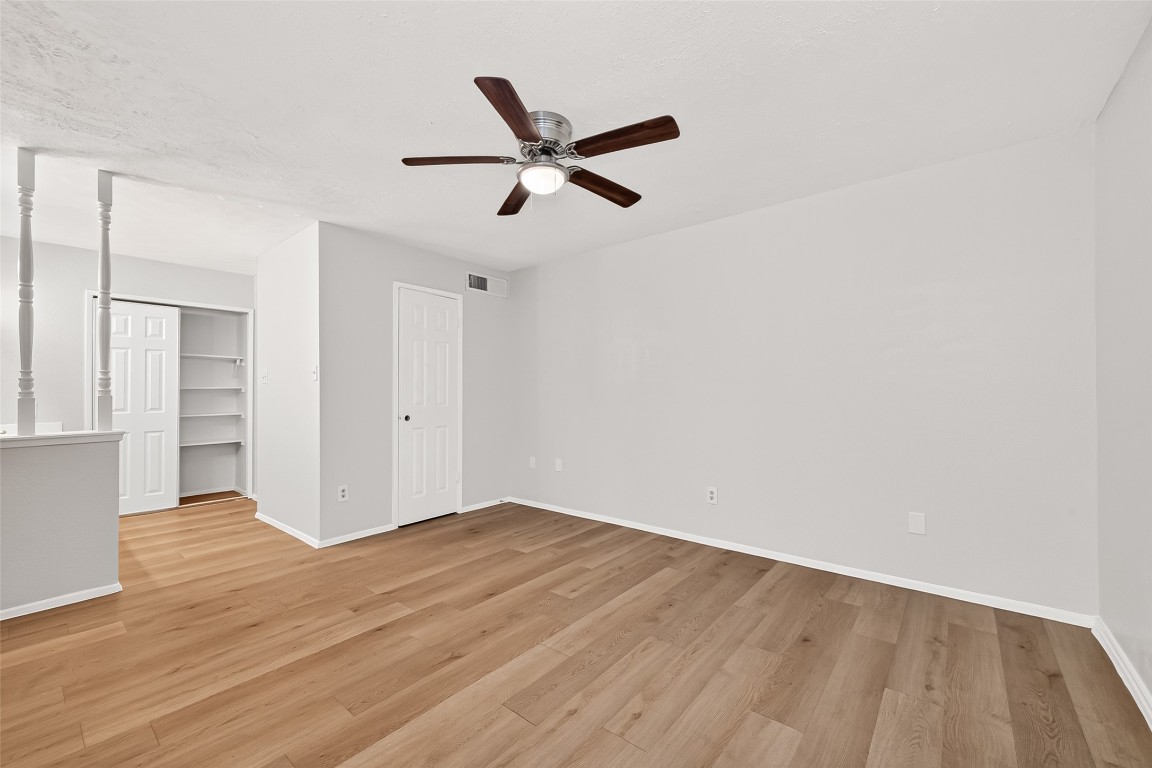 17421 Ranch Country Road Hockley, TX 77447 - Photo 15 of 28 a view of empty room with wooden floor and ceiling fan