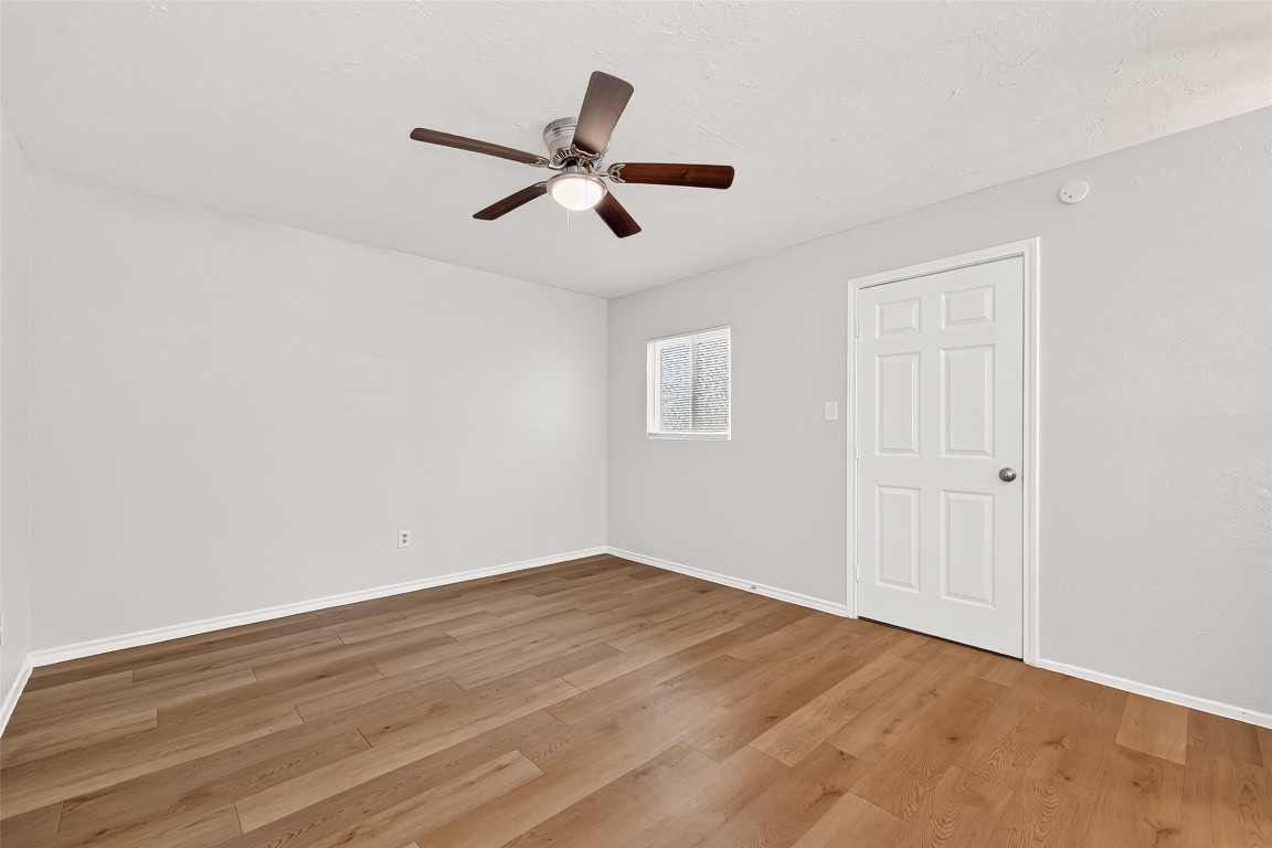 17421 Ranch Country Road Hockley, TX 77447 - Photo 17 of 28 a view of empty room with wooden floor