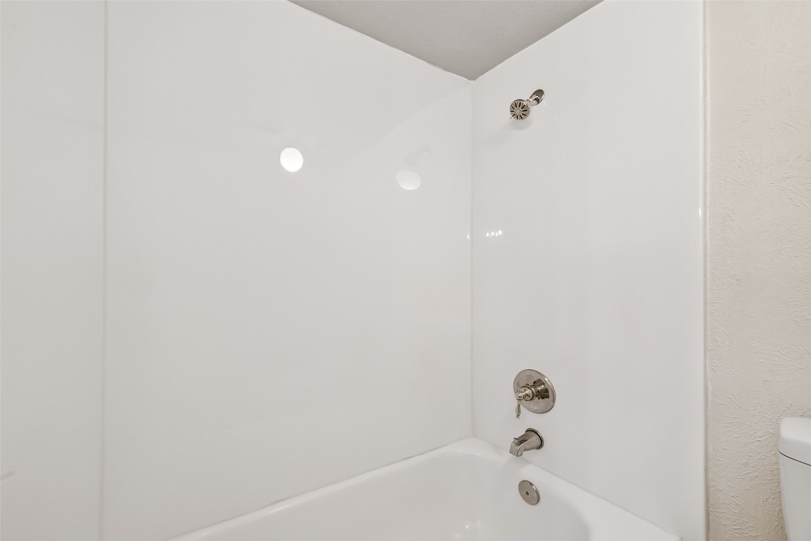17421 Ranch Country Road Hockley, TX 77447 - Photo 19 of 28 a bathroom with a bathtub