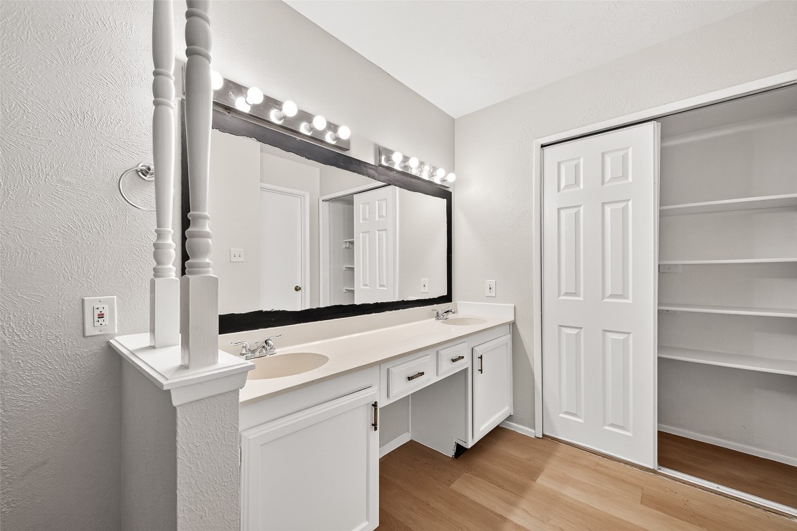 17421 Ranch Country Road Hockley, TX 77447 - Photo 20 of 28 a bathroom with a sink a mirror and a shower