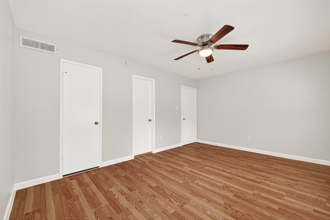 17421 Ranch Country Road Hockley, TX 77447 - Photo 25 of 28 a view of empty room with wooden floor