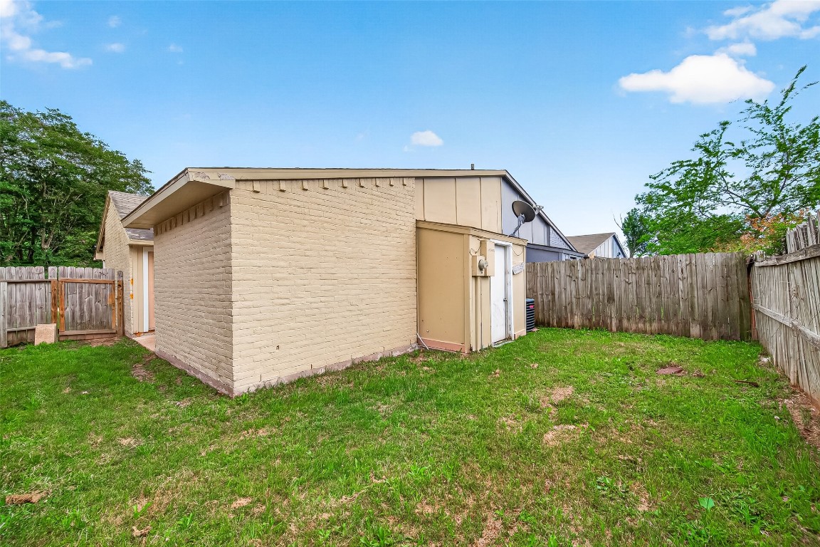 17421 Ranch Country Road Hockley, TX 77447 - Photo 26 of 28 a view of backyard with potted plants and wooden fence