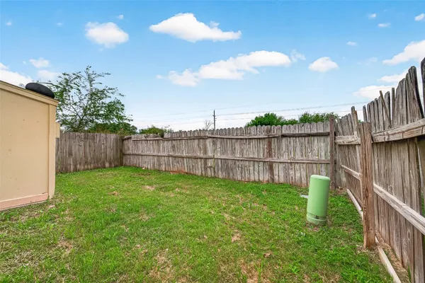 a garden with wooden fence