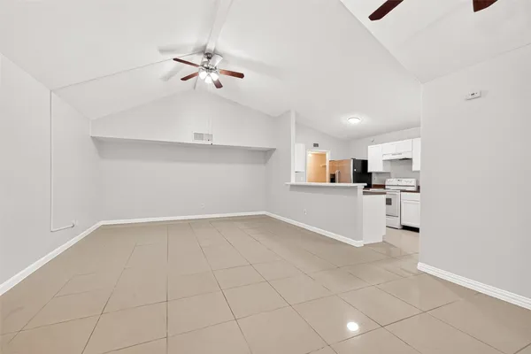a view of a kitchen with a sink and dishwasher cabinets