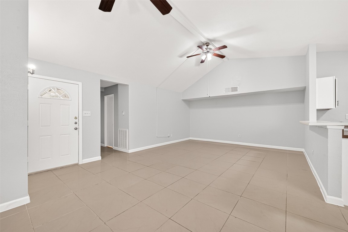 17421 Ranch Country Road Hockley, TX 77447 - Photo 5 of 28 wooden floor in an empty room with a chandelier fan