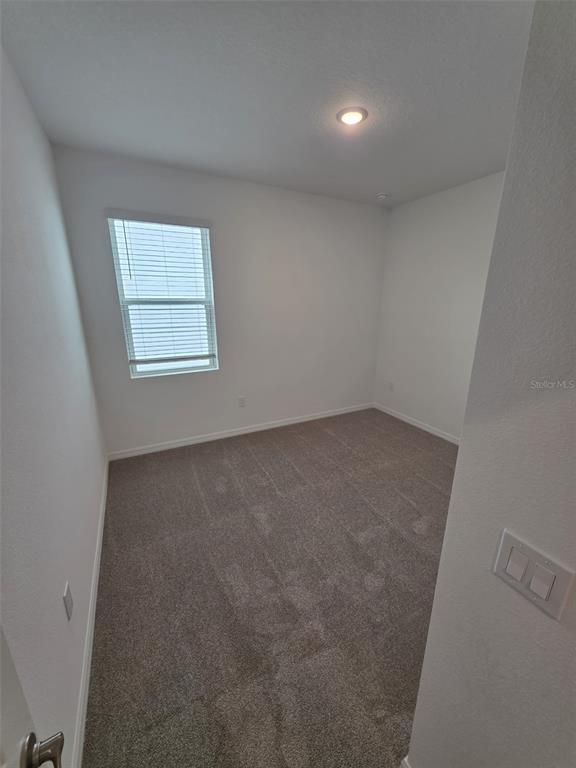 6008 Vision Road St. Cloud, FL 34771 - Photo 4 of 33 an empty room with a window