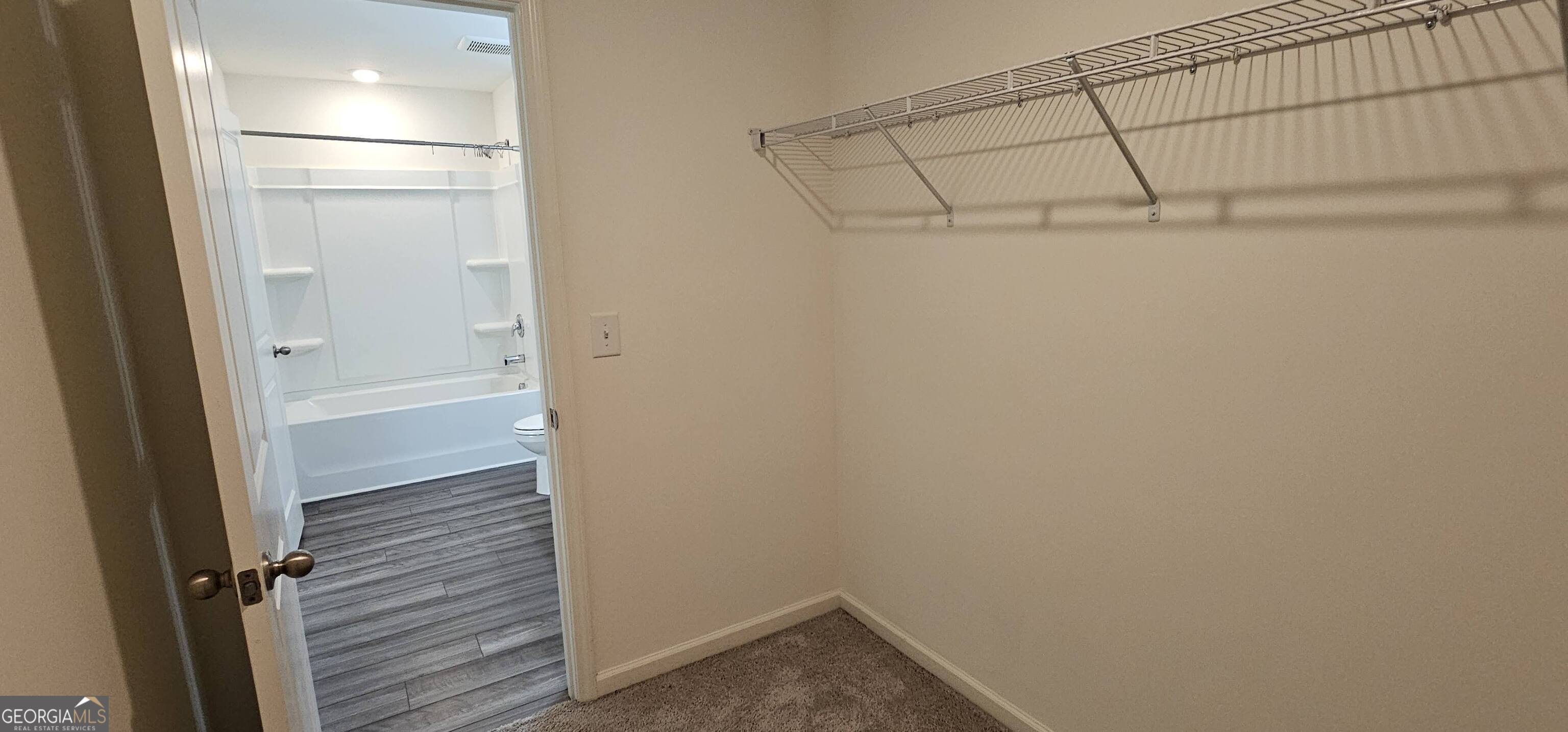 3488 Cardinal Drive Southwest Atlanta, GA 30331 - Photo 17 of 24 a view of an empty walk in closet