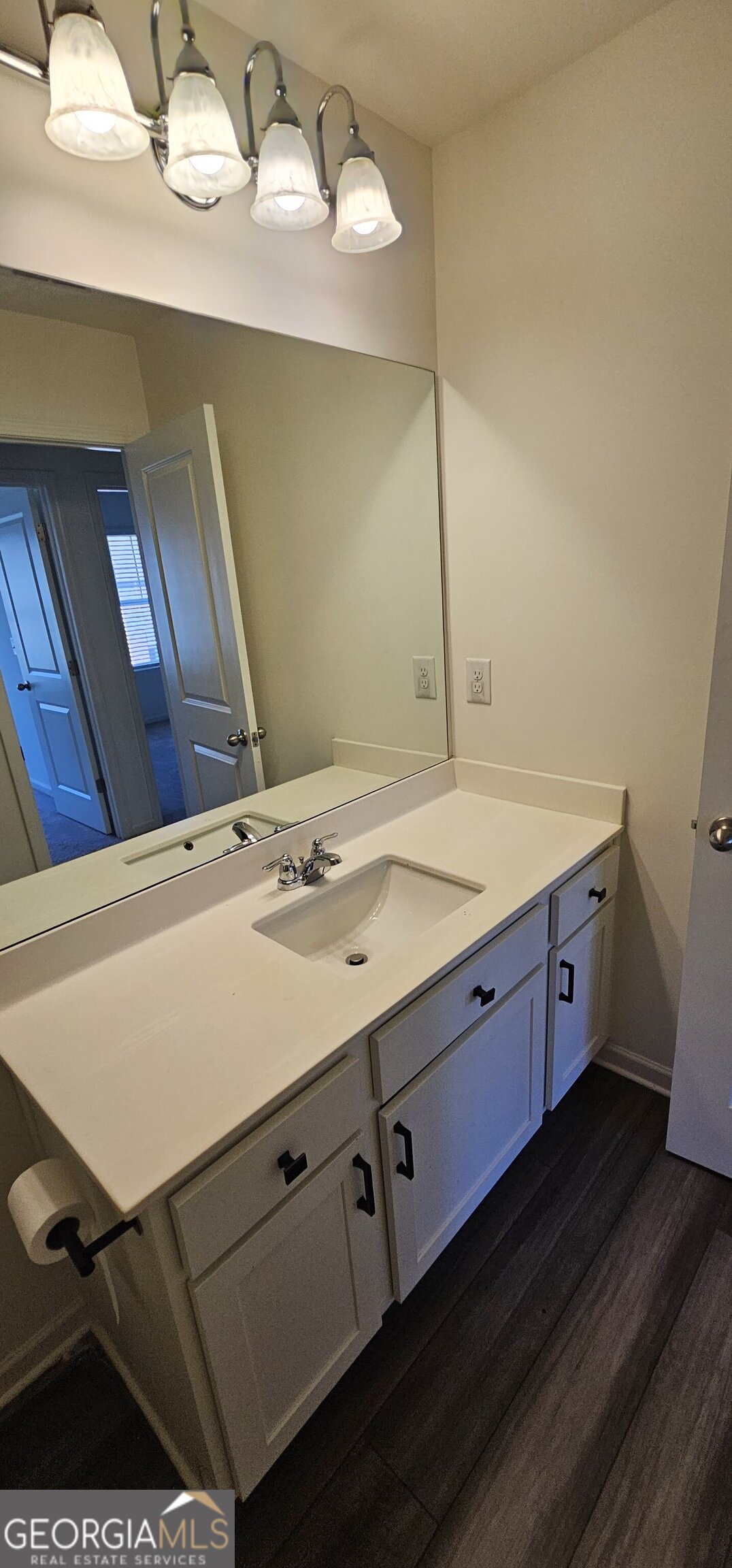 3488 Cardinal Drive Southwest Atlanta, GA 30331 - Photo 24 of 24 a bathroom with a sink and a mirror