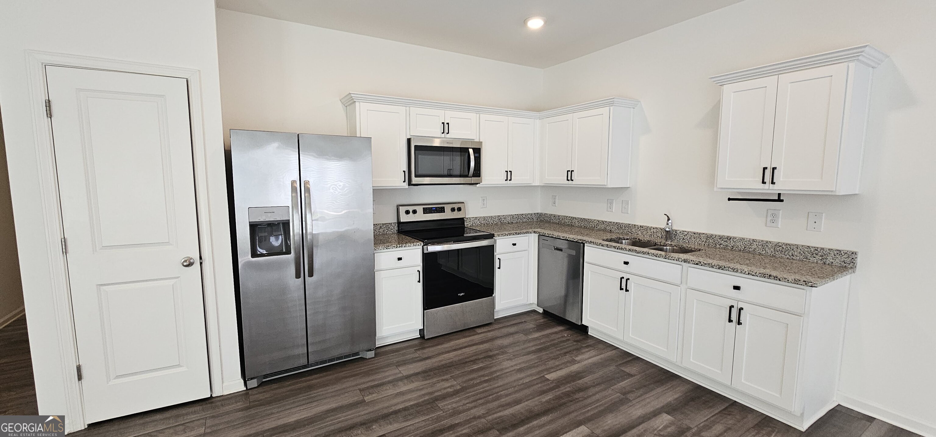 3488 Cardinal Drive Southwest Atlanta, GA 30331 - Photo 7 of 24 a kitchen with stainless steel appliances granite countertop a refrigerator and a stove top oven