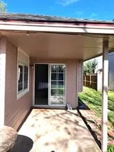a view of backyard with seating space and porch