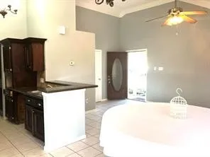 a bedroom with a bed and a chandelier