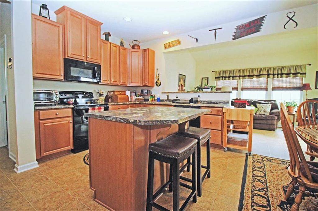 507 Saddle Ridge Court Irwin, PA 15642 - Photo 6 of 24 The kitchen offers plenty of cabinet space, center island and all appliances.