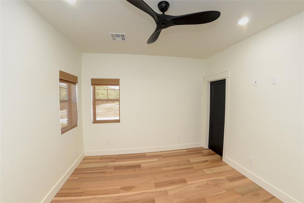 1805 Arthur Road Denison, TX 75021 - Photo 16 of 31 Spare room featuring a ceiling fan, light wood-style flooring, and recessed lighting
