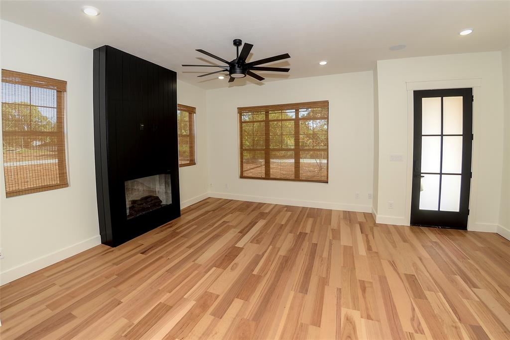 1805 Arthur Road Denison, TX 75021 - Photo 2 of 31 Modern fireplace with built in speakers in the living room.