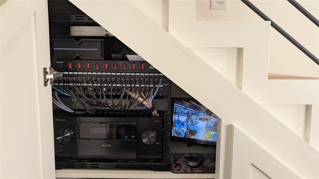 1805 Arthur Road Denison, TX 75021 - Photo 25 of 31 AV rack is wired for cameras, internet, audio and a charging station.