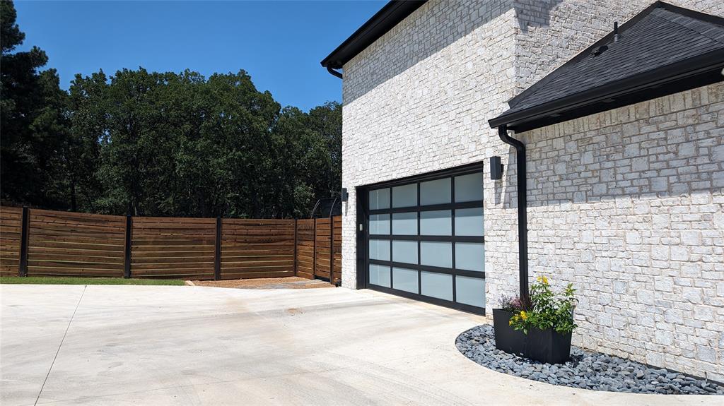 1805 Arthur Road Denison, TX 75021 - Photo 26 of 31 Garage with concrete driveway