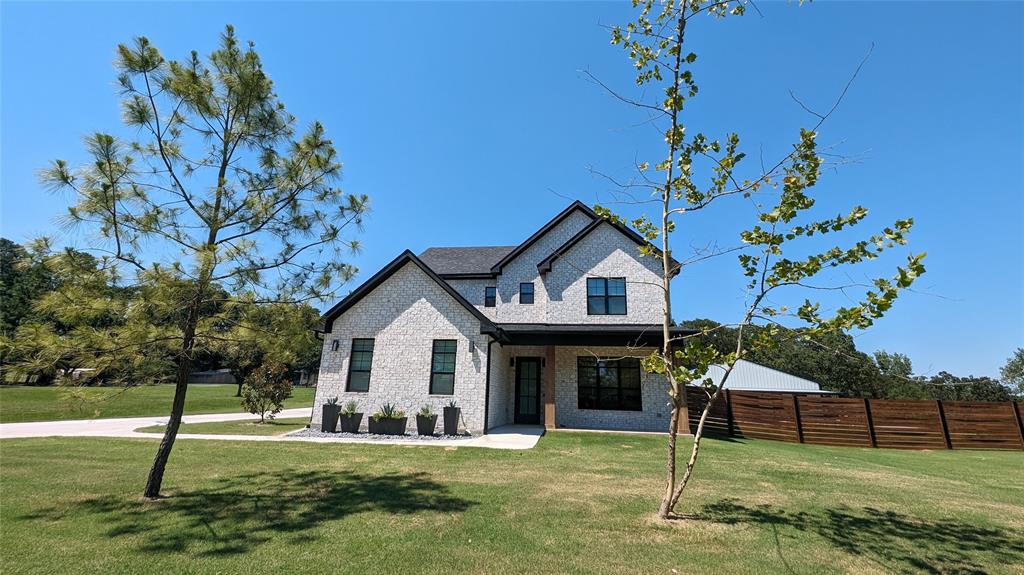 1805 Arthur Road Denison, TX 75021 - Photo 27 of 31 View of front of property featuring brick and beautiful trees.