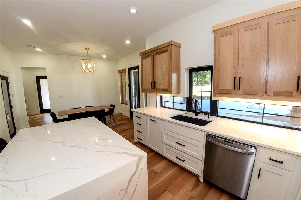 1805 Arthur Road Denison, TX 75021 - Photo 4 of 31 Backsplash windows make it easy to watch the kids out back while cooking.