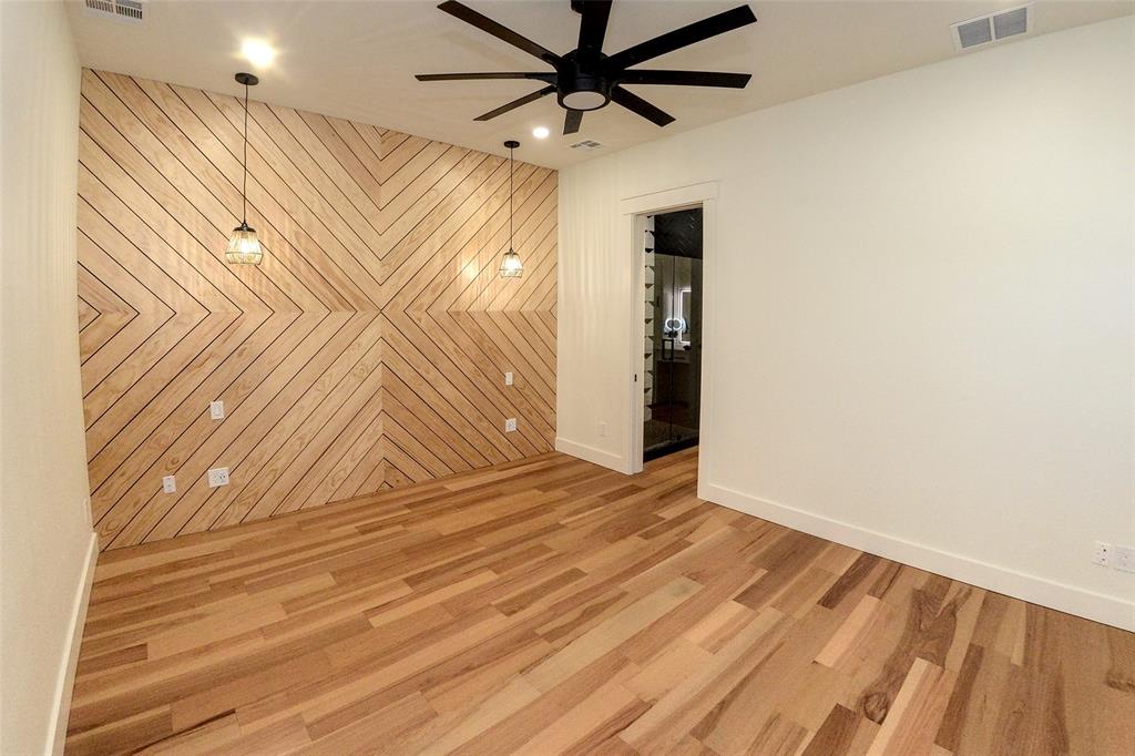 1805 Arthur Road Denison, TX 75021 - Photo 9 of 31 Primary bedroom with accent wall, bedside lights and wired up for optional desk.