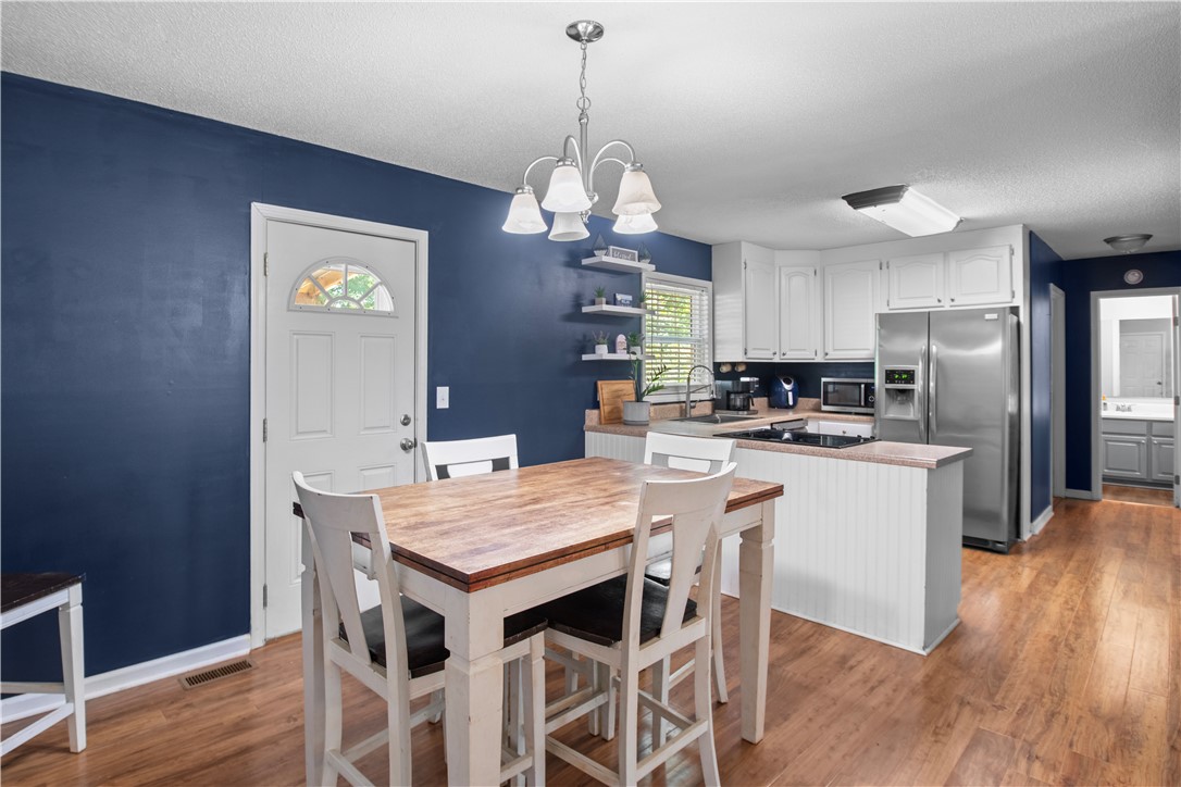 106 Farmgate Road Pickens, SC 29671 - Photo 2 of 38 The dinning room and kitchen are close, making it easy to entertain family and friends