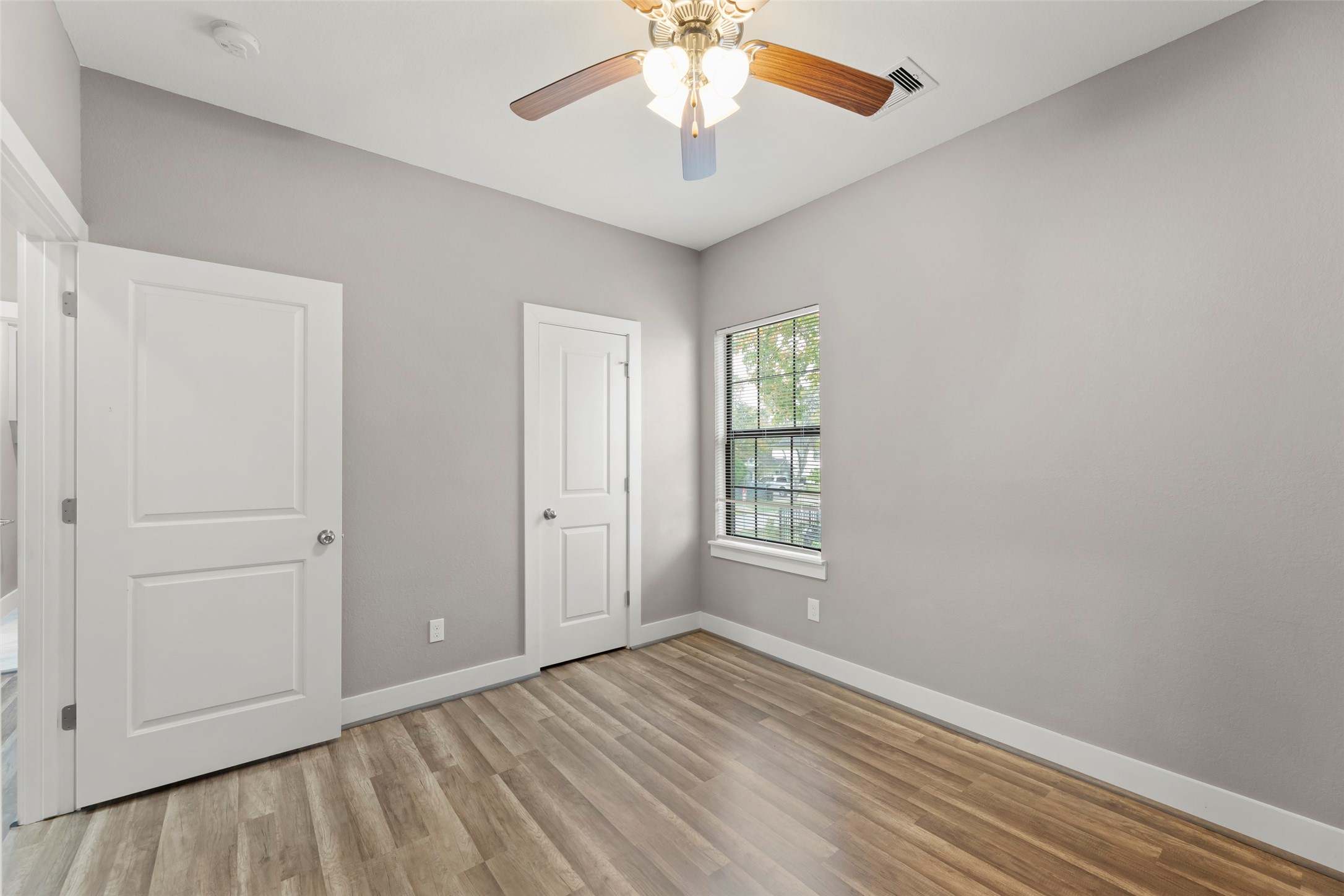 6501 Stratton Street Houston, TX 77023 - Photo 21 of 29 wooden floor in an empty room with a window