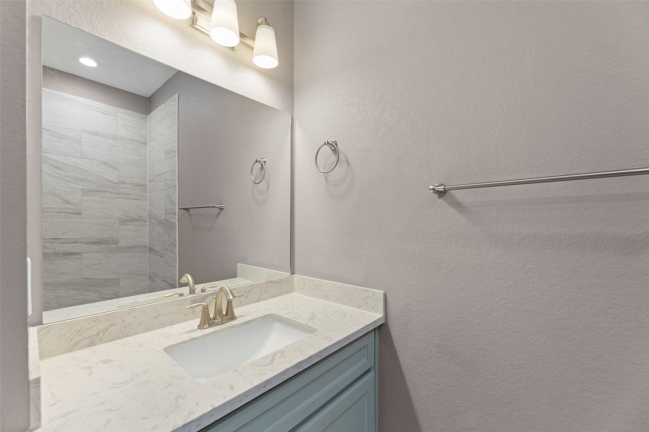 6501 Stratton Street Houston, TX 77023 - Photo 23 of 29 a bathroom with a granite countertop sink mirror and vanity