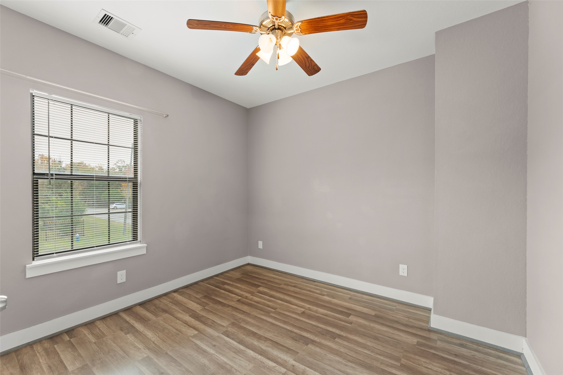 6501 Stratton Street Houston, TX 77023 - Photo 24 of 29 wooden floor in an empty room with a window