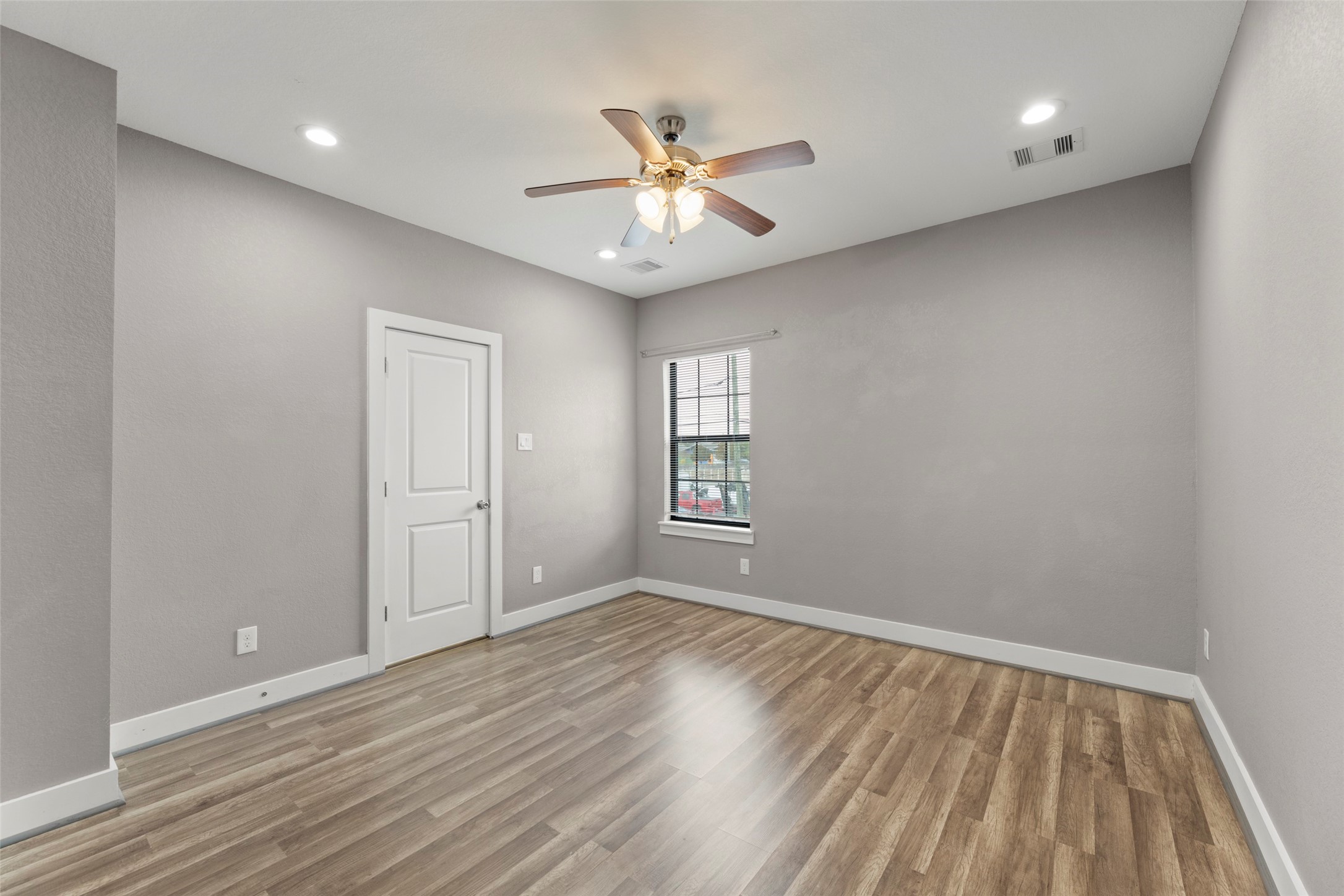 6501 Stratton Street Houston, TX 77023 - Photo 28 of 29 wooden floor in an empty room with a window