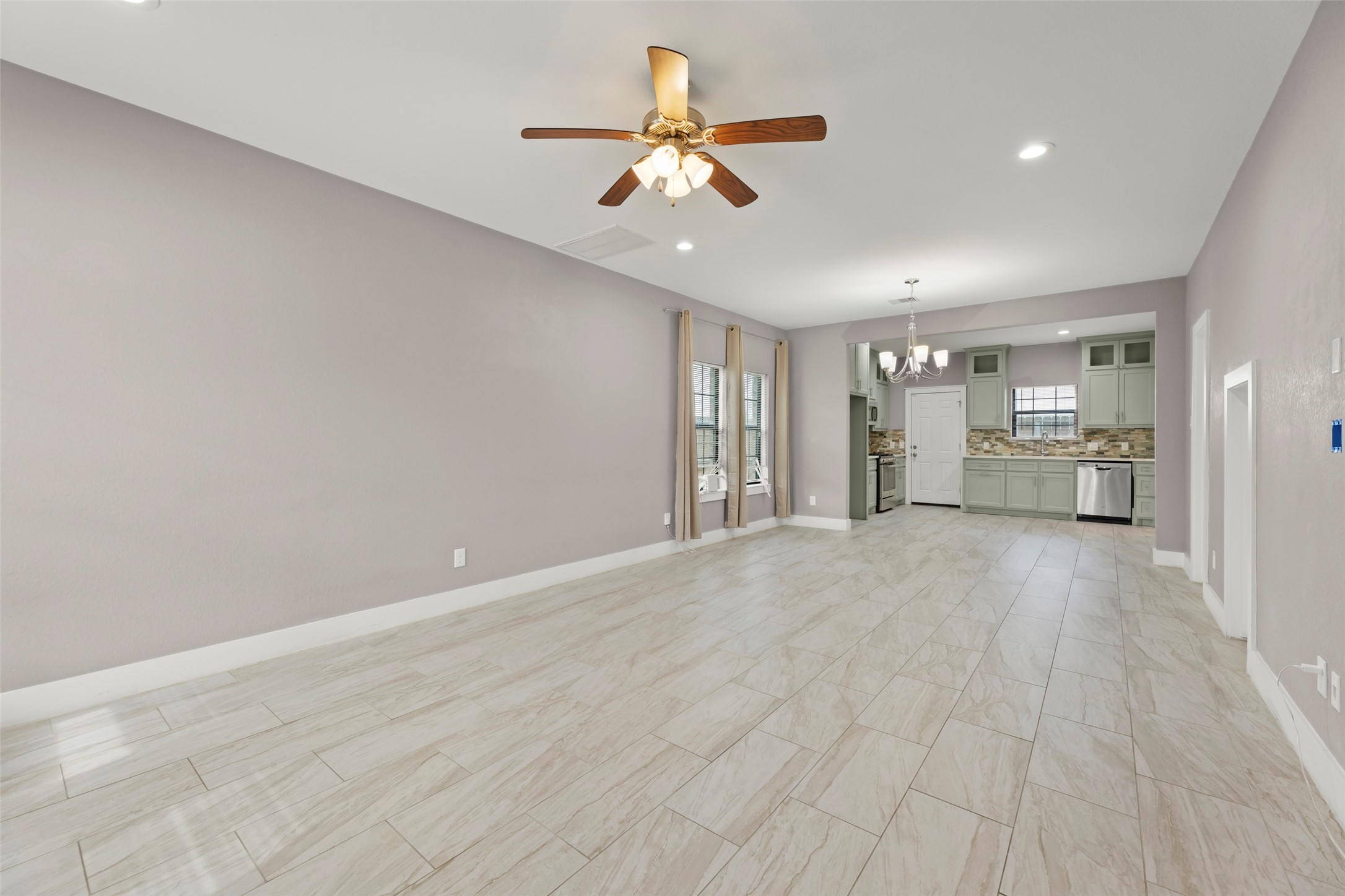 6501 Stratton Street Houston, TX 77023 - Photo 6 of 29 a view of an empty room and a ceiling fan window